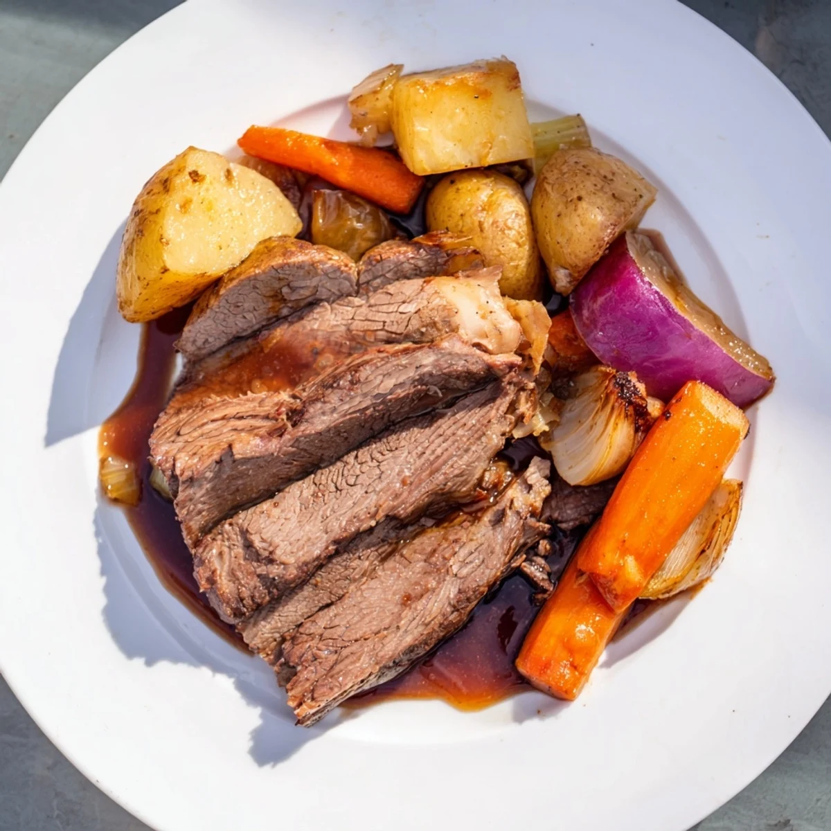 Hearty Sunday Pot Roast with vibrant roasted veggies and juicy beef; a perfect family dinner.