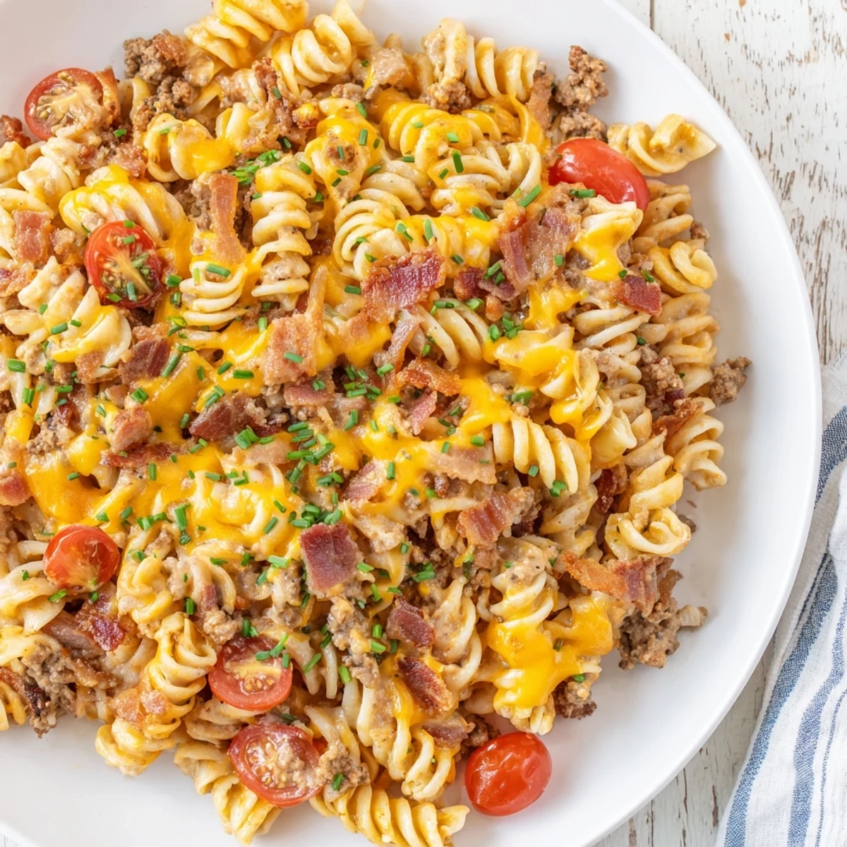 Creamy Bacon Cheeseburger Pasta Bake with a golden, bubbly cheese topping, perfect for dinner tonight.