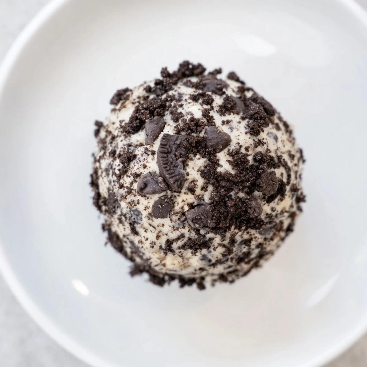 These glistening Cream Cheese Oreo Protein Balls feature a delightful mix of flavors and textures, perfect snacking.