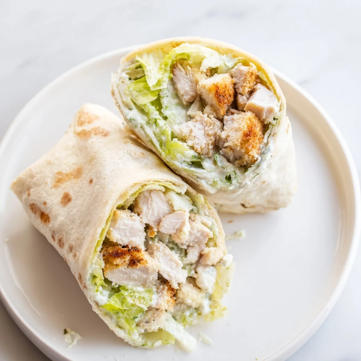 Close-up of a Chicken Caesar Wrap, filled with flavorful chicken and cheese, ready to grab.