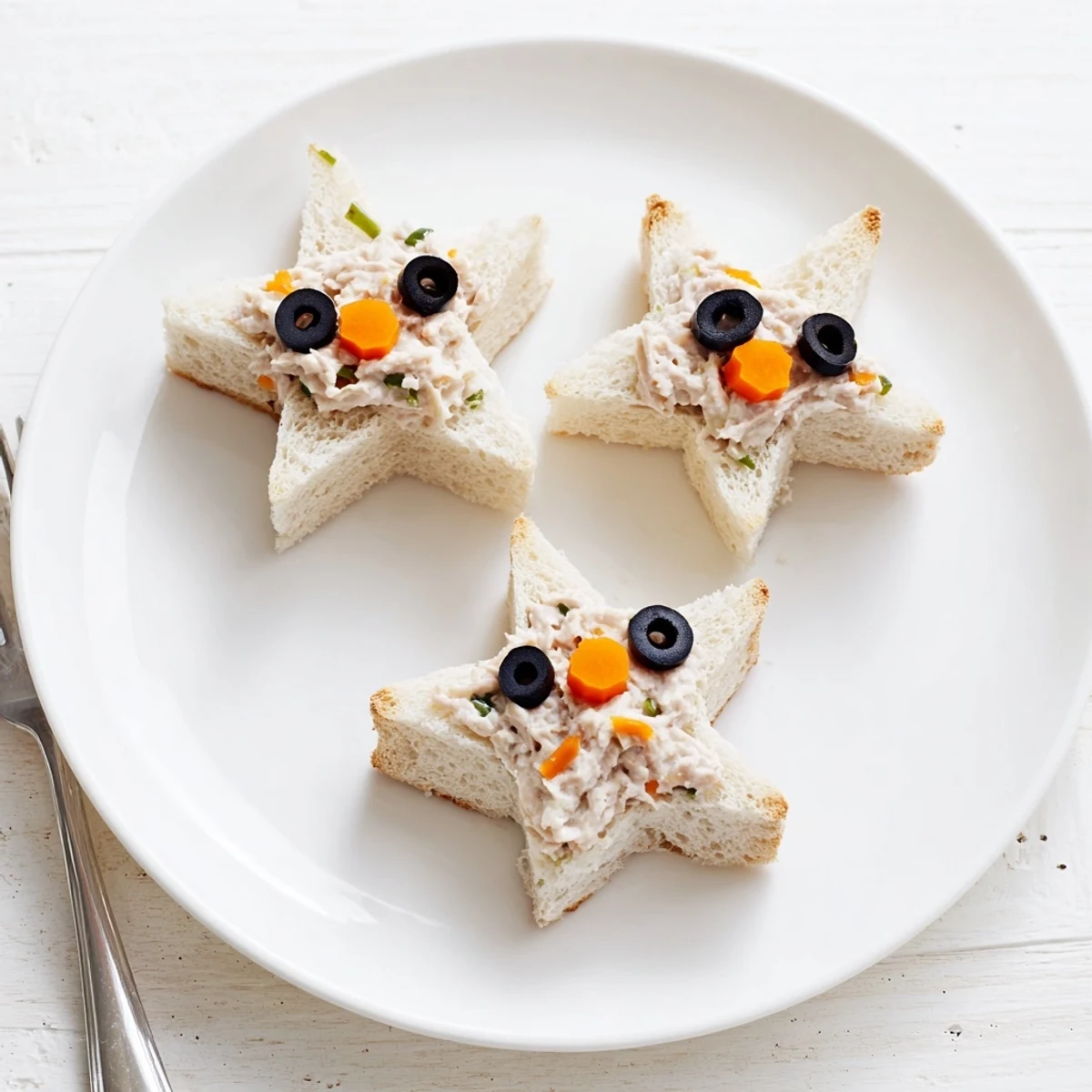 Freshly assembled Mini Starfish Sandwiches with tuna filling, ready to serve at a colorful party.