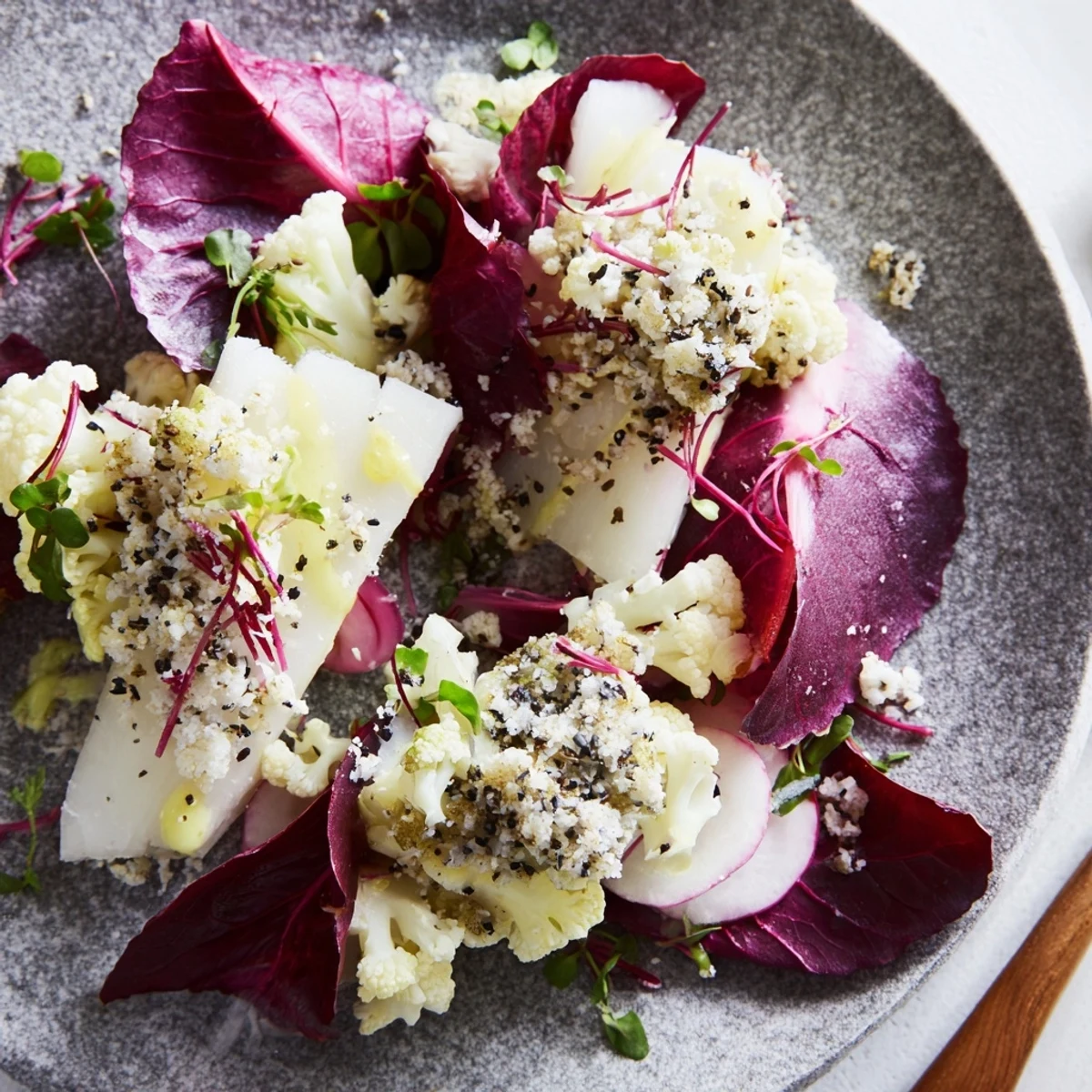 The Tundra Trek salad, a minimalist appetizer with crisp vegetables and a light lemon dressing.