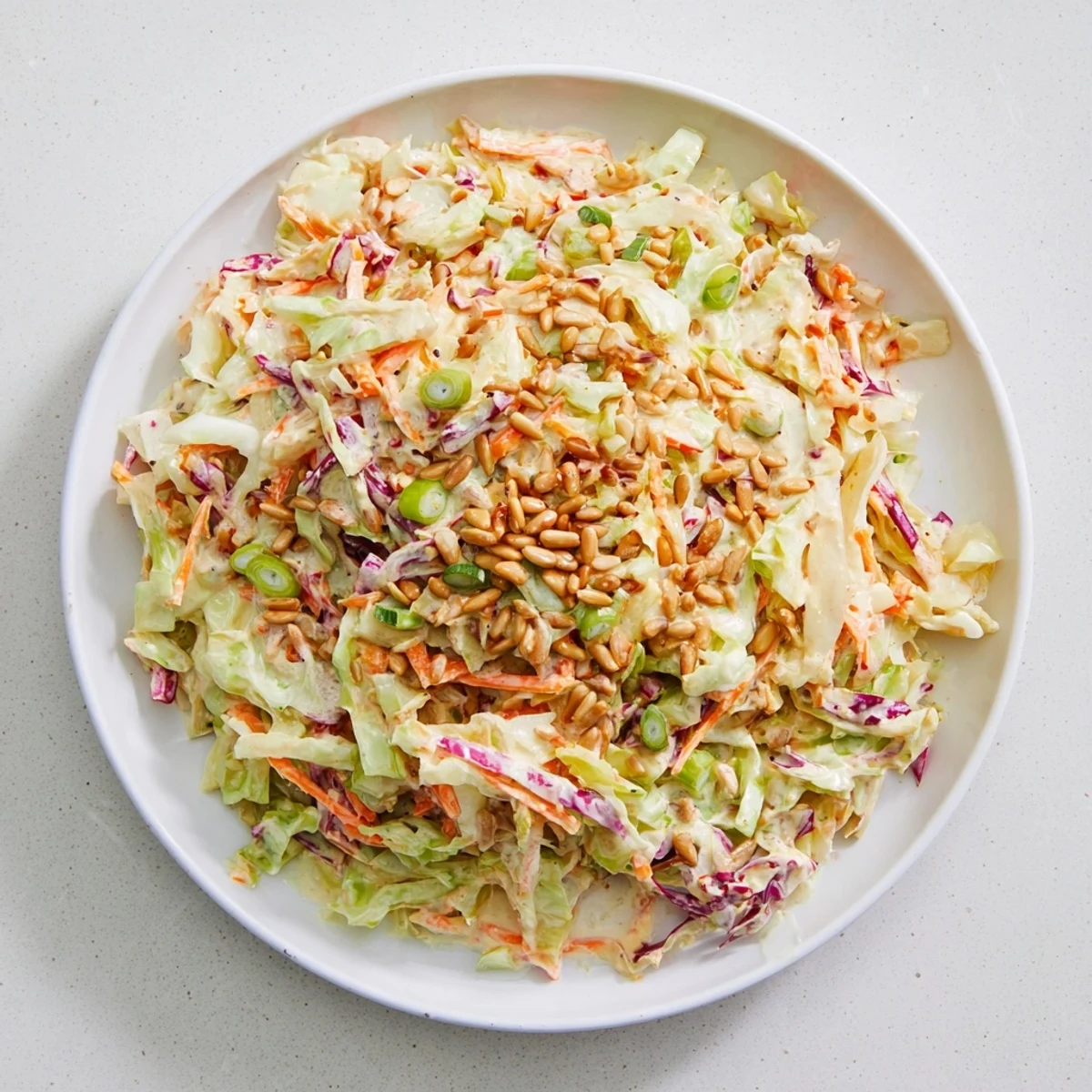 Vibrant plate of Crunchy Coleslaw Salad, perfect as a side dish at your summer BBQ.