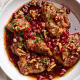 Hearty Iranian Fesenjan simmering in a Dutch oven, a beautiful Persian dish ready to serve.