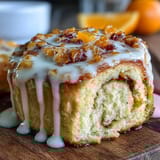 Fluffy orange rolls with fresh zest, baked golden and topped with a sweet citrus glaze for a bright breakfast treat.