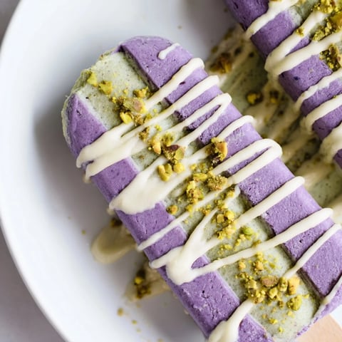 Creamy ube and pistachio ice cream bars layered for a colorful summer treat.  