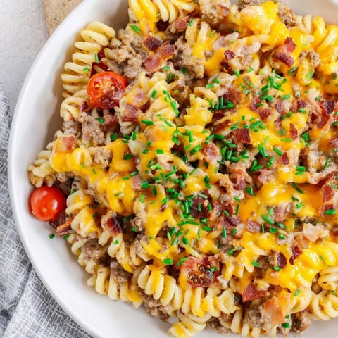 A bubbling Bacon Cheeseburger Pasta Bake with crispy bacon and melted cheese, ready to serve.