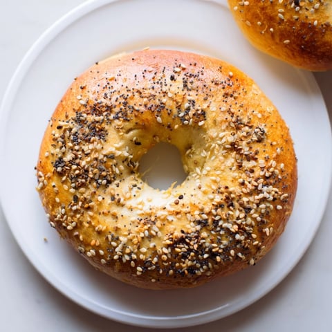 Freshly baked homemade budget bagels, golden brown, ready to be sliced and enjoyed for breakfast.