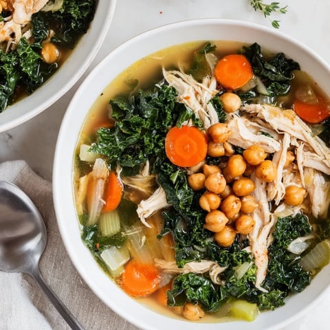 Golden, crispy chickpeas crown a bowl of flavorful Chicken Kale Soup, ready to enjoy.