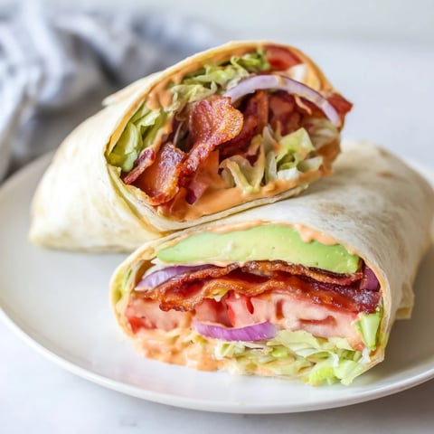 Crispy bacon, fresh tomatoes, and chipotle mayo star in these Zesty BLT Wraps.