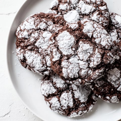 Air-Fried Chocolate Crinkle Cookies: A close-up view of crackled, powdered sugar-dusted, homemade cookies.