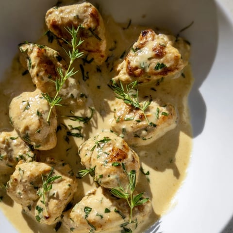 Golden-brown Lighter Creamy Tarragon Chicken, tenderly coated in a vibrant, fragrant sauce, is ready to serve.