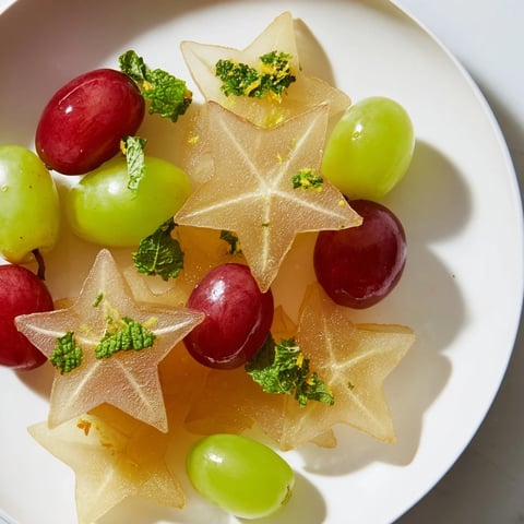 Brunch fruit garnish: Beautiful starfruit slices and juicy grapes arranged for a colorful, healthy side.