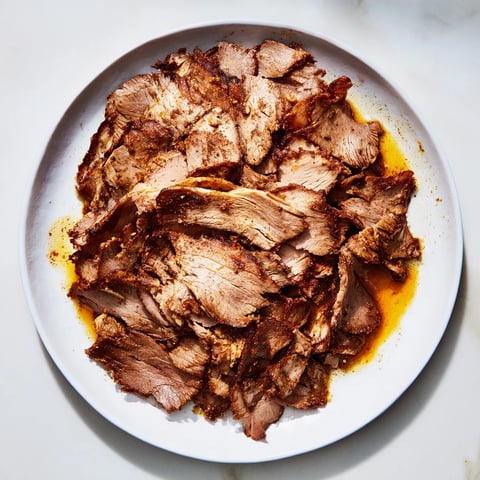 Sizzling Turkish Döner Meat, perfectly sliced, ready to be wrapped in warm flatbreads with fresh accompaniments.