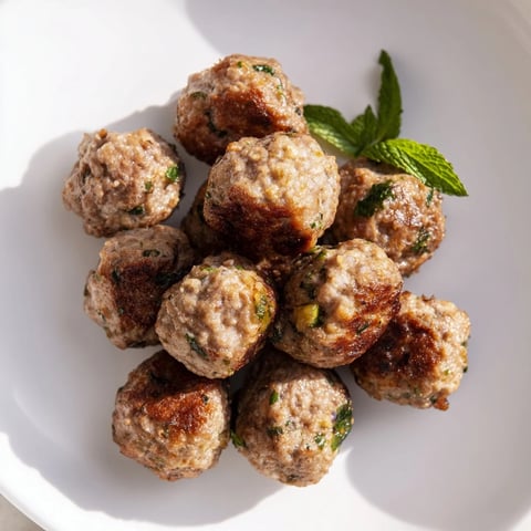 Golden-brown Turkish Köfte Meatballs, flavorful and juicy, ready to be served with a fresh side.