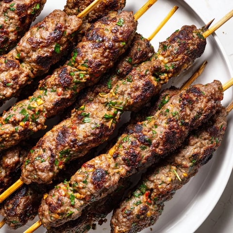 Smoky Iraqi Kebab Tikka bursting with savory spice, perfectly grilled, ready for flatbread and toppings.