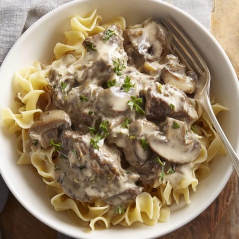 Savor the rich flavors of creamy ranch beef stroganoff served with fresh parsley.  
