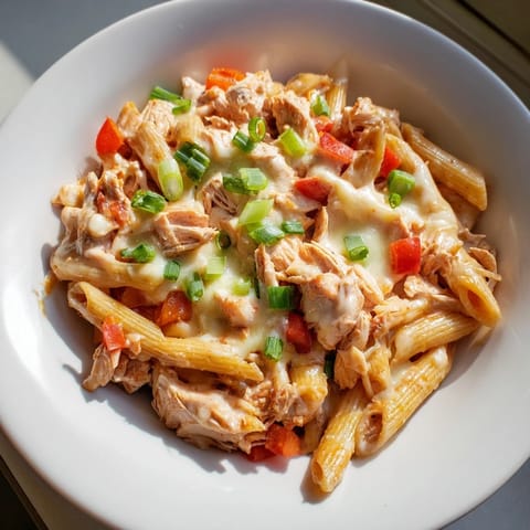 A quick and easy Buffalo Chicken Pasta Skillet, featuring tender chicken and vibrant red bell peppers.
