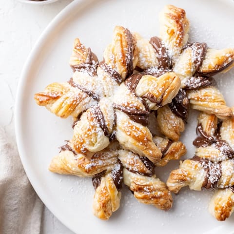 Warm and delightful: Picture those Express Nutella Puff Pastry Snowflakes fresh from the oven, glistening.
