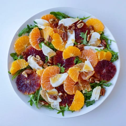 Close-up of Winter Citrus & Candied Pecan Salad, highlighting the candied pecan's crunch and citrus's brightness.