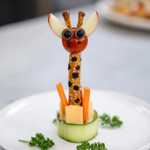 Fun Long-Necked Giraffe Snack Tower ready to be devoured, a whimsical healthy treat for kids and parties.