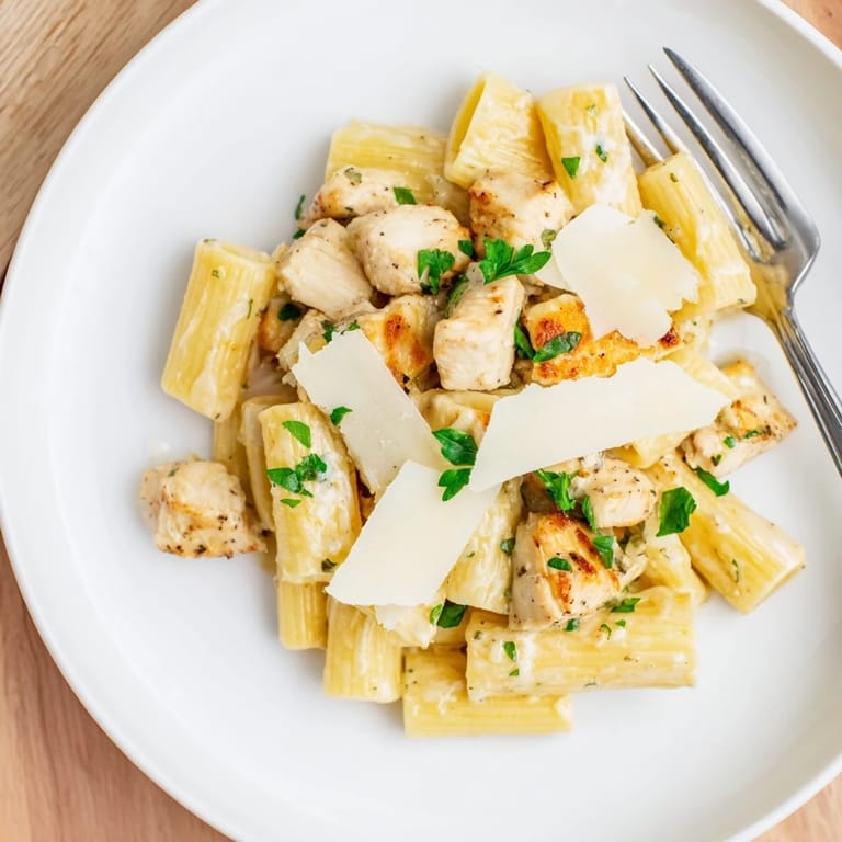 A plate of Creamy Garlic Parmesan Chicken Rigatoni featuring creamy sauce and tender chicken.  
