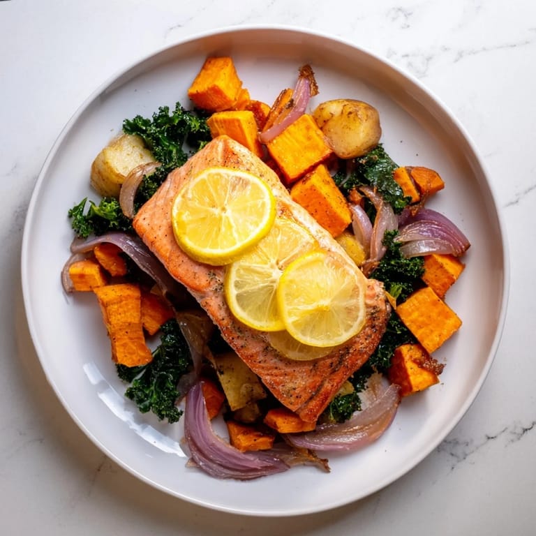 Vibrant image of Sheet-Pan Salmon featuring golden-brown veggies and tender, cooked fish.