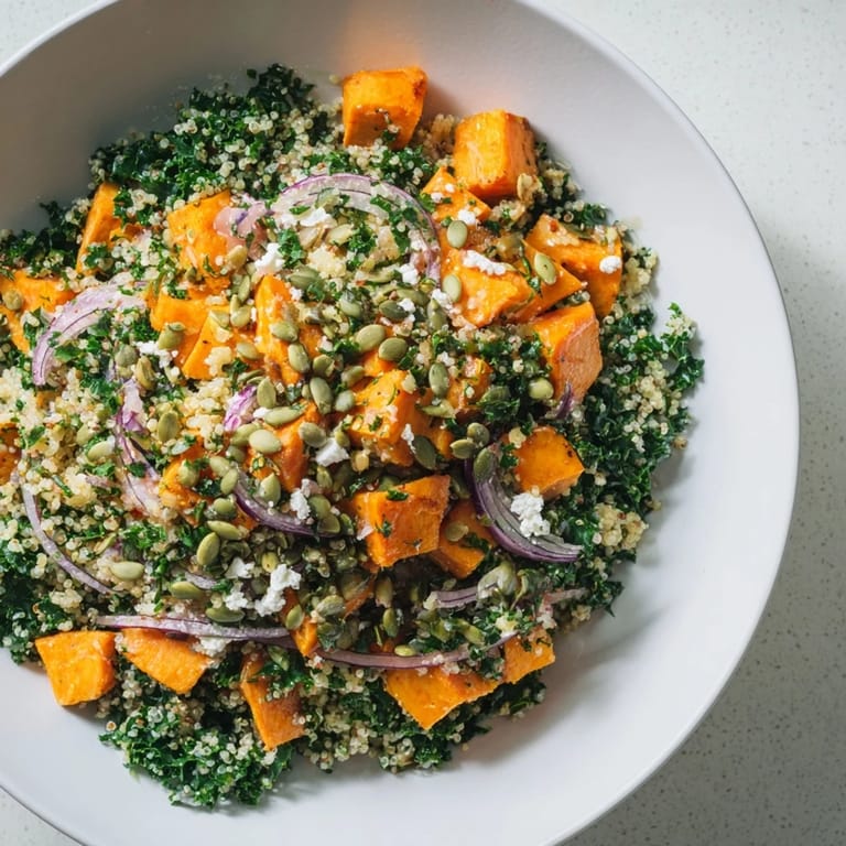 Enjoy a colorful close-up of this delicious Kale & Quinoa Salad with fresh lemon dressing and toppings.