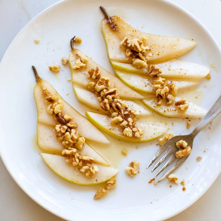 Close up shot of pear slices artistically arranged with honey, perfect for a light treat.