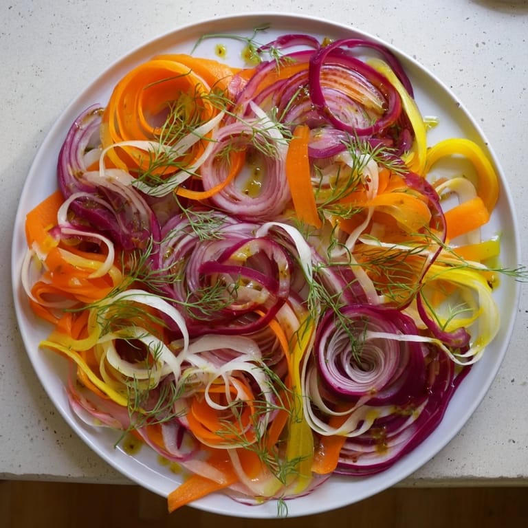 A perfect view of this fresh The Spinning Top salad, with wispy vegetables drizzled beautifully.