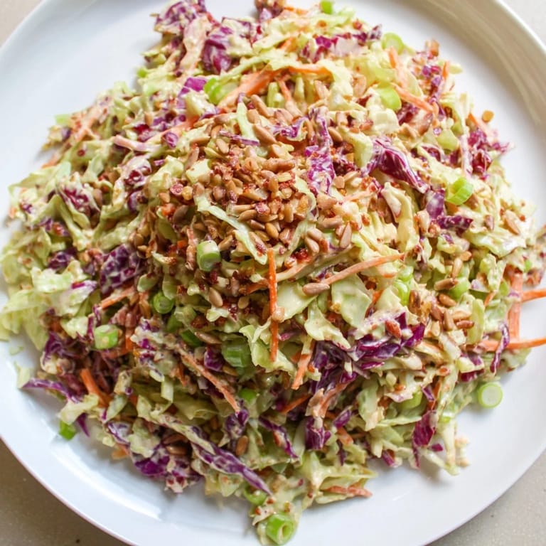 Fresh, crisp shredded cabbage and carrots in a homemade Crunchy Coleslaw Salad recipe.